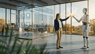 Eine Frau interagiert mit einem Roboter in einem hellen, freundlichen Büro